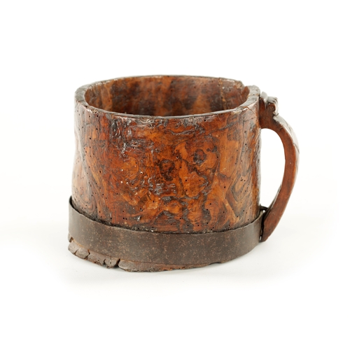 916 - AN 18TH CENTURY SCANDINAVIAN BURR ELM AND IRON BOUND MUG with cross hatched shaped side handle. (13c... 