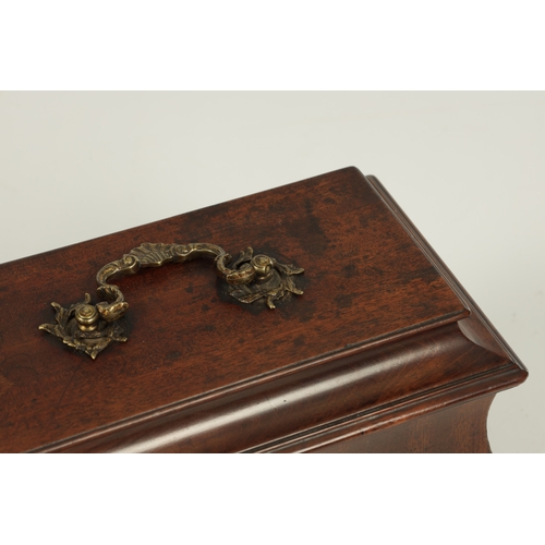 917 - AN UNUSUAL EARLY GEORGE III MAHOGANY TEA CADDY OF OGEE SHAPE the hinged moulded top with folding bra... 