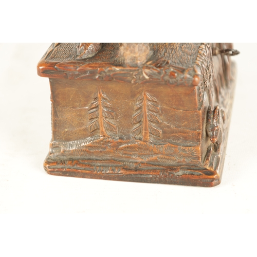 923 - A 19TH CENTURY BLACK FOREST CARVED LINDEN WOOD JEWELLERY BOX with figural hinged lid and farm yard s... 