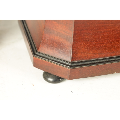 926 - A WILLIAM IV MAHOGANY AND EBONISED TEA CADDY of sarcophagus shape with hinged top having a fitted in... 