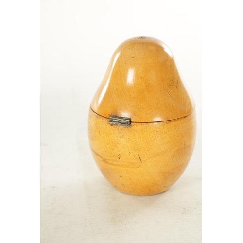 927 - A GEORGE III FRUIT WOOD TEA CADDY FORMED AS A PEAR with hinged top and oval silvered brass escutcheo... 