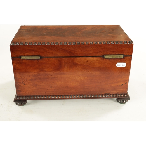 929 - A WILLIAM IV FIGURED MAHOGANY TEA CADDY with moulded edge and bun feet; having a fully fitted interi... 