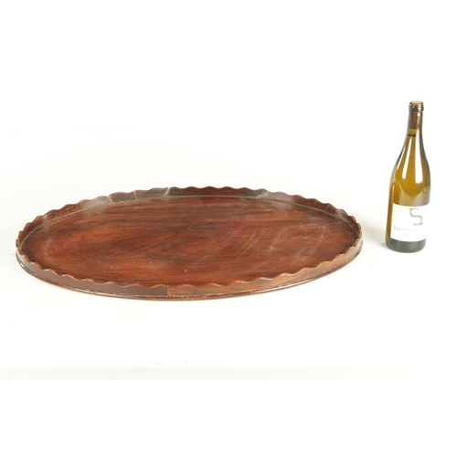 944 - AN 18TH CENTURY OVAL MAHOGANY TRAY with wavy edge gallery. (71cm wide 53cm deep )