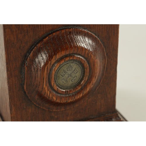 946 - A 19TH CENTURY OAK OBLISK with painted turned finial and inset medallion having a crown and cross ke... 