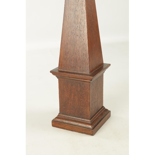 946 - A 19TH CENTURY OAK OBLISK with painted turned finial and inset medallion having a crown and cross ke... 