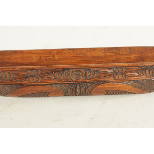 947 - A 19TH / 20TH CENTURY CARVED SOUTH ISLANDS SCULPTURE OF A BOAT with scrolled carved decoration. (31c... 