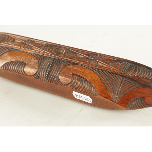 947 - A 19TH / 20TH CENTURY CARVED SOUTH ISLANDS SCULPTURE OF A BOAT with scrolled carved decoration. (31c... 