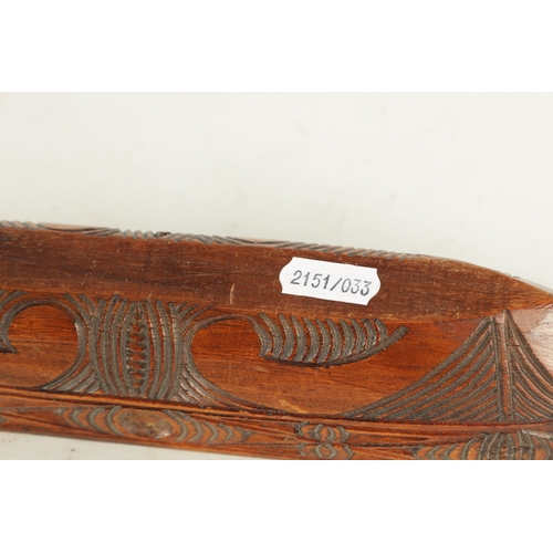 947 - A 19TH / 20TH CENTURY CARVED SOUTH ISLANDS SCULPTURE OF A BOAT with scrolled carved decoration. (31c... 