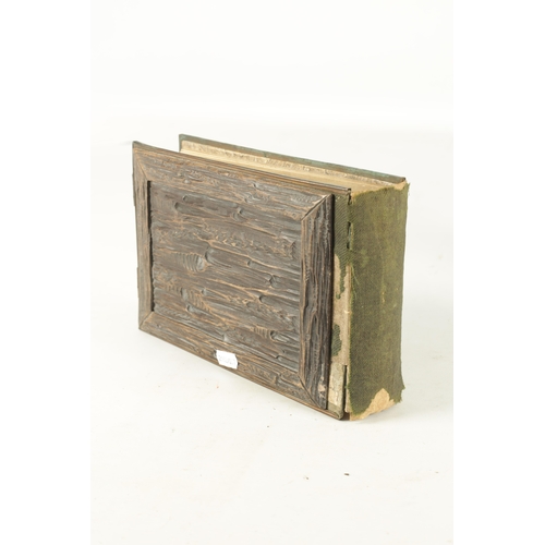 950 - A 19TH CENTURY BLACK FOREST PHOTO ALBUM with carved cover having a hound in a country setting (25cm ... 