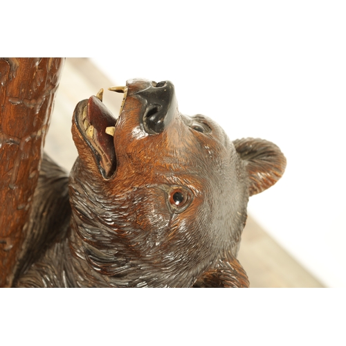 951 - A 19TH CENTURY CARVED LINDEN WOOD BLACK FOREST BEAR AND CUB HALL STAND depicting a carved standing b... 