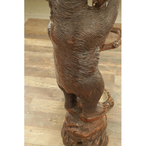 951 - A 19TH CENTURY CARVED LINDEN WOOD BLACK FOREST BEAR AND CUB HALL STAND depicting a carved standing b... 