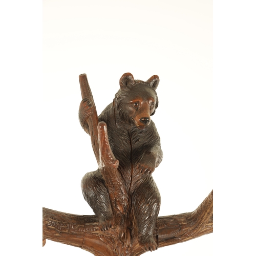 951 - A 19TH CENTURY CARVED LINDEN WOOD BLACK FOREST BEAR AND CUB HALL STAND depicting a carved standing b... 