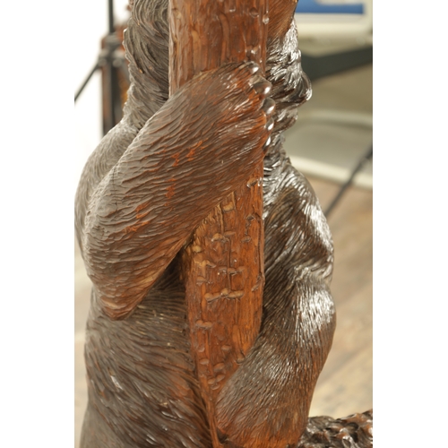 951 - A 19TH CENTURY CARVED LINDEN WOOD BLACK FOREST BEAR AND CUB HALL STAND depicting a carved standing b... 