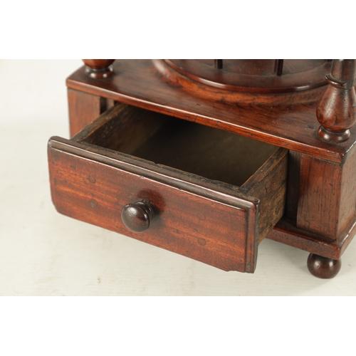 956 - A 19TH CENTURY ROSEWOOD BOBBIN STAND having a tiered stand with a domed pin cushion, a base with a s... 