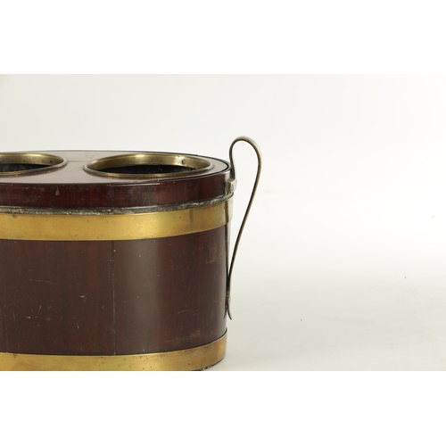 964 - A RARE GEORGE III MAHOGANY AND BRASS BOUND TABLE TOP WINE COOLER of oval form for two bottles having... 