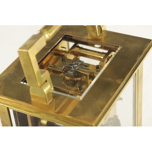 1002 - A LATE 19TH CENTURY FRENCH GIANT STRIKING CARRIAGE CLOCK, the brass glazed case enclosing a white en... 