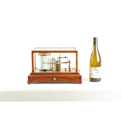 1006 - NEGRETTI & ZAMBRA, LONDON. AN EARLY 20TH CENTURY OAK CASED BAROGRAPH with bevelled glass panels on a... 