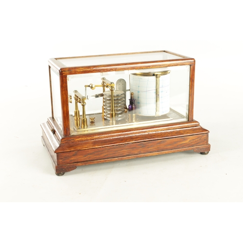 1006 - NEGRETTI & ZAMBRA, LONDON. AN EARLY 20TH CENTURY OAK CASED BAROGRAPH with bevelled glass panels on a... 