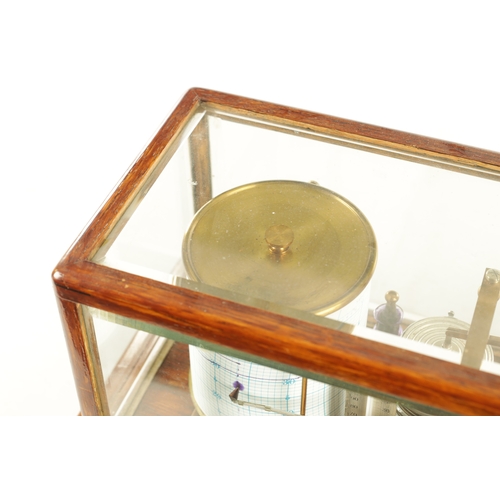 1006 - NEGRETTI & ZAMBRA, LONDON. AN EARLY 20TH CENTURY OAK CASED BAROGRAPH with bevelled glass panels on a... 