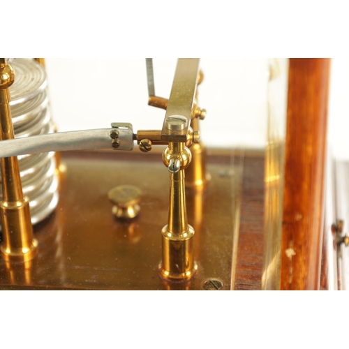 1006 - NEGRETTI & ZAMBRA, LONDON. AN EARLY 20TH CENTURY OAK CASED BAROGRAPH with bevelled glass panels on a... 