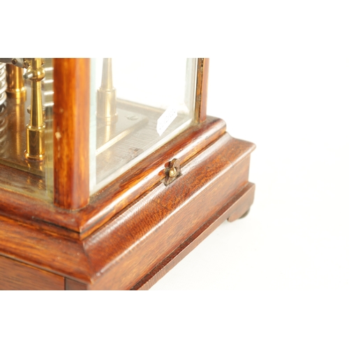 1006 - NEGRETTI & ZAMBRA, LONDON. AN EARLY 20TH CENTURY OAK CASED BAROGRAPH with bevelled glass panels on a... 