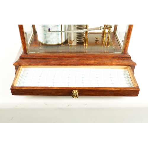 1006 - NEGRETTI & ZAMBRA, LONDON. AN EARLY 20TH CENTURY OAK CASED BAROGRAPH with bevelled glass panels on a... 