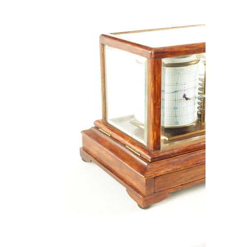 1006 - NEGRETTI & ZAMBRA, LONDON. AN EARLY 20TH CENTURY OAK CASED BAROGRAPH with bevelled glass panels on a... 