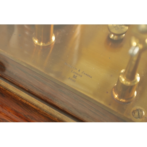 1006 - NEGRETTI & ZAMBRA, LONDON. AN EARLY 20TH CENTURY OAK CASED BAROGRAPH with bevelled glass panels on a... 