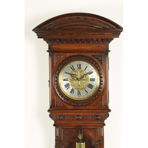 1010 - A. BERTL, WIEN. AN UNUSUAL OAK CASED WEIGHT DRIVEN VIENNA WALL CLOCK, the carved arched top case wit... 