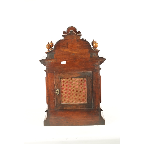 1022 - A LATE 19TH CENTURY GERMAN WALNUT QUARTER CHIMING BRACKET CLOCK, with carved caryatid columns enclos... 