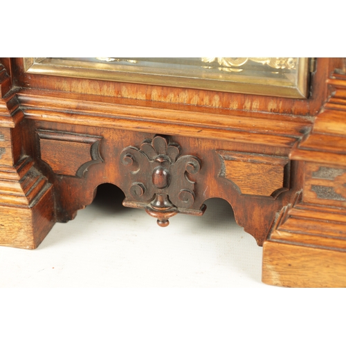 1022 - A LATE 19TH CENTURY GERMAN WALNUT QUARTER CHIMING BRACKET CLOCK, with carved caryatid columns enclos... 