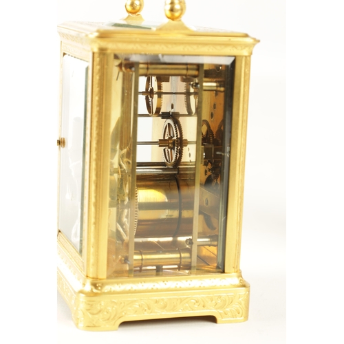 1026 - A LATE 19TH CENTURY FRENCH GILT ENGRAVED CARRIAGE CLOCK the gilt brass case with scroll work engravi... 