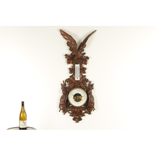 1028 - A LATE 19TH CENTURY BLACK FOREST CARVED BAROMETER, the case surmounted by an eagle above a carved oa... 