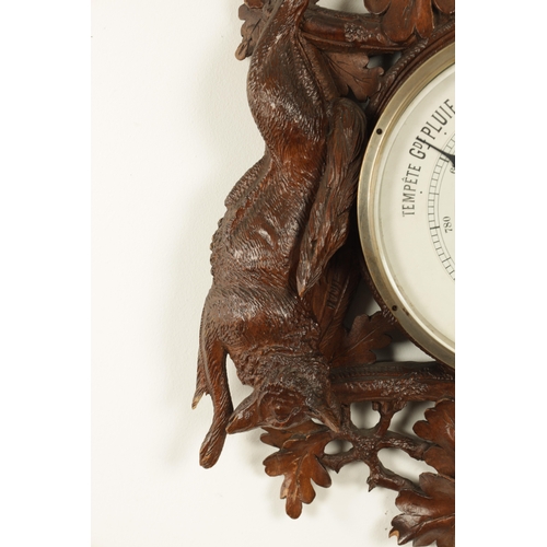 1028 - A LATE 19TH CENTURY BLACK FOREST CARVED BAROMETER, the case surmounted by an eagle above a carved oa... 