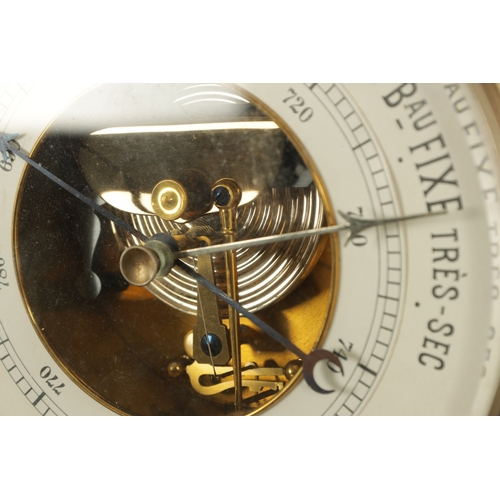 1028 - A LATE 19TH CENTURY BLACK FOREST CARVED BAROMETER, the case surmounted by an eagle above a carved oa... 