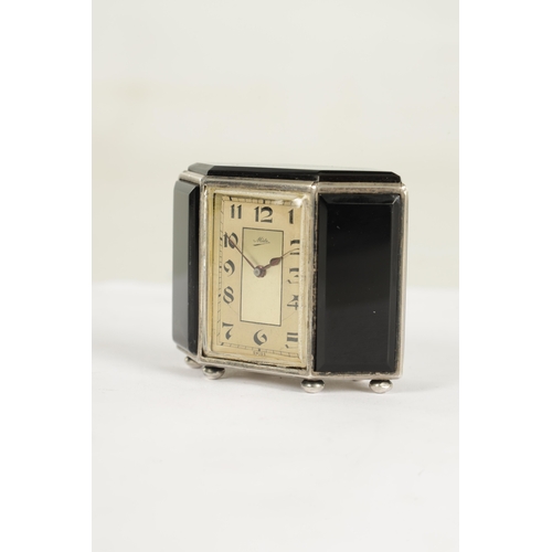 1032 - AN ART DECO SWISS SILVER AND BLACK ONYX BOUDOIR CLOCK SIGNED MIDO, the silver case set with five bev... 