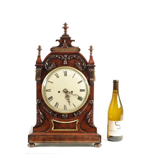 1035 - A WILLIAM IV FIGURED MAHOGANY DOUBLE FUSEE BRACKET CLOCK having a shaped pediment above a foliate ca... 