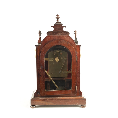 1035 - A WILLIAM IV FIGURED MAHOGANY DOUBLE FUSEE BRACKET CLOCK having a shaped pediment above a foliate ca... 