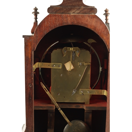 1035 - A WILLIAM IV FIGURED MAHOGANY DOUBLE FUSEE BRACKET CLOCK having a shaped pediment above a foliate ca... 