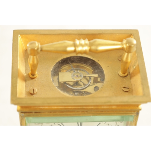 1036 - A 19TH CENTURY ENGLISH BRASS FUSEE CARRIAGE CLOCK the plain case with a raised fixed handle on ball ... 