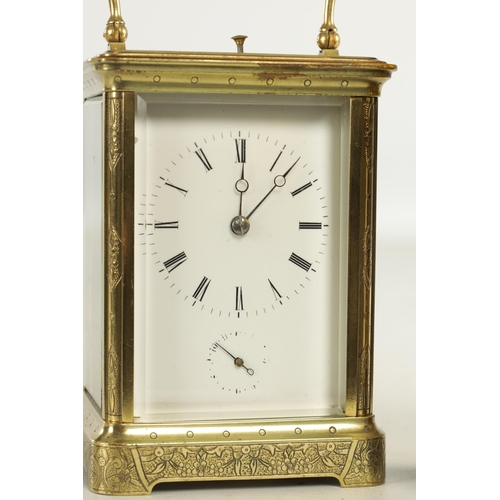 1041 - A LATE 19TH CENTURY FRENCH ENGRAVED REPEATING CARRIAGE CLOCK the brass corniche case with engraved f... 