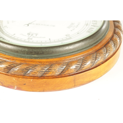 1043 - J. PLACE, BIRMINGHAM. A LARGE LATE 19TH CENTURY ANEROID BAROMETER, having a carved oak rope edge sur... 