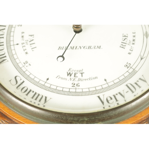 1043 - J. PLACE, BIRMINGHAM. A LARGE LATE 19TH CENTURY ANEROID BAROMETER, having a carved oak rope edge sur... 