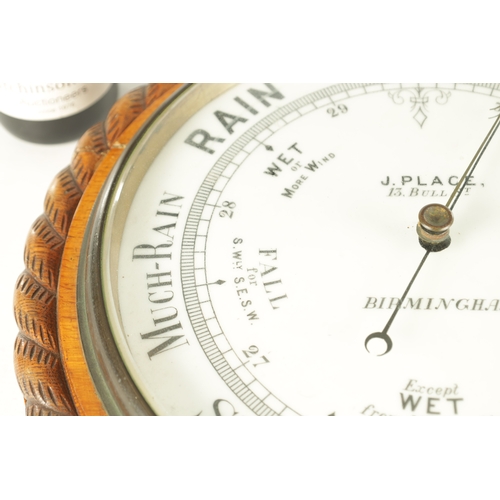 1043 - J. PLACE, BIRMINGHAM. A LARGE LATE 19TH CENTURY ANEROID BAROMETER, having a carved oak rope edge sur... 