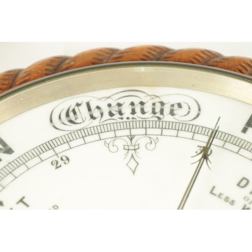 1043 - J. PLACE, BIRMINGHAM. A LARGE LATE 19TH CENTURY ANEROID BAROMETER, having a carved oak rope edge sur... 