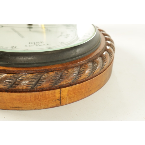 1043 - J. PLACE, BIRMINGHAM. A LARGE LATE 19TH CENTURY ANEROID BAROMETER, having a carved oak rope edge sur... 