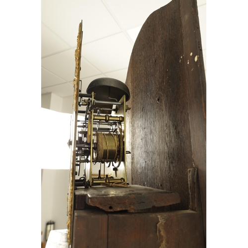 1071 - JOHN TOMBS, LONDON. A GEORGE III FIGURED MAHOGANY LONGCASE CLOCK, the case with swan neck pediment a... 