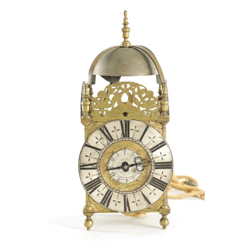 1080 - JOHN GOODMAN, AN EARLY 18TH CENTURY BRASS LANTERN CLOCK, having a posted frame and large steel bell ... 