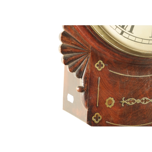 1097 - A LATE REGENCY FIGURED MAHOGANY CONVEX DIAL WALL CLOCK, having a brass inlaid case with carved fan e... 