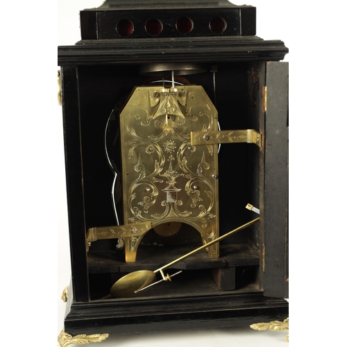 1102 - SPENCER & PERKINS, LONDON. A GEORGE III EBONIZED ORMOLU MOUNTED BRACKET CLOCK, having a bell top ped... 